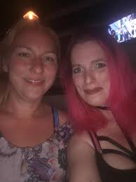 Playing guitar at downtown shopping party