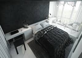 A black wrought queen size bed with shaggy and printed decorative pillows acts as the focal point of this charming haven. Black Bedrooms With An Alluring Femininity