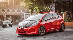 If you've considered swapping a larger honda engine into your modified honda jazz/fit project, then it's likely that you'll be using the stock radiator, headers, and possibly even the exhaust the donor engine came with. Jazz Red Mobil
