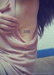 By combining a roman numeral tattoo with the arrow symbol you can cross off two major body art trends in one fell swoop. Celebrity Favorite Roman Numeral Tattoos Fmag Com