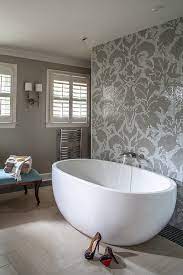 These sleek wall panels are straightforward to clean and look stylish too! Gray Mosaic Damask Bathroom Tiles With Modern Tub Transitional Bathroom