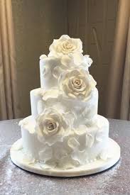 65 of 85 add bundles of blooms Large White Flower Cascade Wedding Cake Le Papillon Patisserie