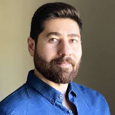 What is the expression for the impulse response of a PET scanner?