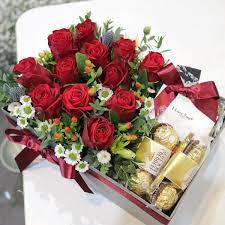 Box of chocolates and flowers, a gift for valentine's day. Red Roses And Chocolates Gift Box Amman Jordan Free Delivery