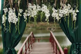 After your big day, hang them in your home! Beautiful Stylish Wedding Aisle Pathway With White Floral Garland Stock Photo Picture And Royalty Free Image Image 75882072
