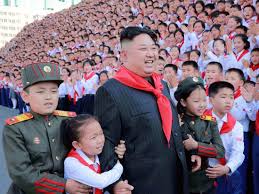 People watch a television news broadcast showing file footage of north korean leader kim jong un, at a railway station in seoul on april 21, 2020. North Koreans Worship Kim Jong Un Business Insider