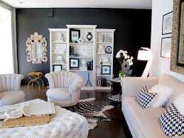 White walls make the black, quilted sectional recliner stand out, while the curtains and wall decor connect the theme. Living Room Black And White Wall Pictures Novocom Top