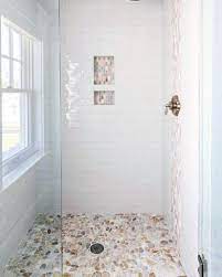 9 Budget Friendly Bathroom Decoration Ideas Mymove Bathroom Remodel Shower Shower Tile Pebble Shower Floor