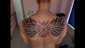 Tribal cross tattoo with wing. Tattoo On Back Wings And Cross Timewaps How To Tattoo Youtube