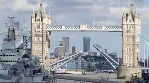 A boat sails down the river thames in front of tower bridge that is stuck in the fully open position due to a technical fault, in london on august 9, 2021. Tower Bridge Stuck Open Causing Traffic Chaos Bbc News