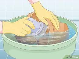 Our tips for how to clean and repair outdoor pots, a springtime garden chore, using brushes, caulk, homemade cleaners, mineral oil, and burlap liners. How To Clean Plant Containers 10 Steps With Pictures Wikihow