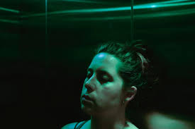 After wandering the streets of Southbank for a couple of hours, I head back  to the hotel. Jess is leaning against the lift wall, her head resting  against the lift wall, like