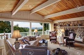 This ceiling treatment has become increasingly popular over the years and presents an interesting way for diy homeowners to dress up an often overlooked aspect of the home. Old Fashion Living Room With Vaulted Wood Plank Ceiling Walkout Deck And Rocky Fireplace View Of Antique Furniture Stock Photo Picture And Royalty Free Image Image 29735691