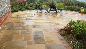In a wheelbarrow, mix one part dry cement with 12 parts stone dust to use as a setting bed for the bluestone. How To Build A Stone Patio On Your Own Hirerush Blog
