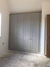 The color is not particularly a strong grey but more like a shade of lite grey color. Shaker Fitted Wardrobes By Simply Fitted Wardrobes Fitted Wardrobes Bedroom Bedroom Built In Wardrobe Fitted Bedroom Furniture