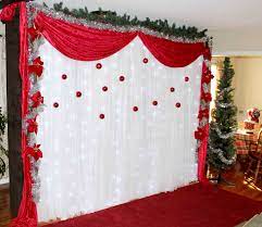 Diy photo booth backdrop made by crepe paper, ribbon and ornaments. Photo Booth Rentals Kansas City Rent A Wedding Photo Booth Christmas Photo Booth Backdrop Christmas Photo Booth Diy Christmas Backdrop