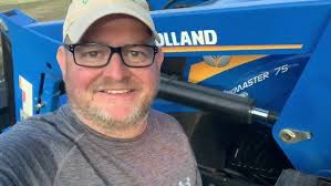 New Holland Workmaster 75 doing chores