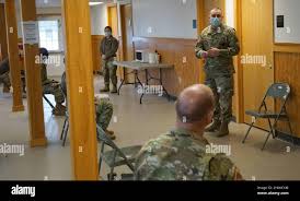 Combat medics with the Pennsylvania National Guard provide security while  another renders tactical field care to a simulated casualty as part of the  TC8-800 medic sustainment course March 2 at Fort Indiantown
