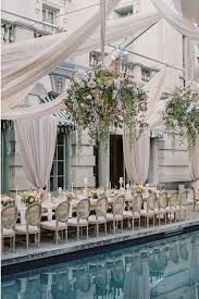 Reception Table Decor Inspired By Old World Charm Dinner Served Partially Al Fresco In The Back Garde Reception Table Decorations Floral Chandelier Wedding
