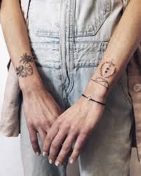 Wrist tattoo that wraps right around the arm is sometimes referred to as bracelet tattoos. Little Wrist Shield Tattoos Tattoogrid Net