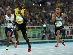 Usain bolt running against all 100m gold medalists. Usain Bolt Smiles While Running 100 Meters Photos Sports Illustrated