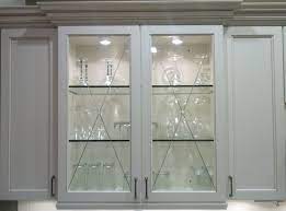 Slated matte aluminum shoe fences keep footwear in place. Kitchen Cabinet Glass Inserts Cabinet Glass Panels