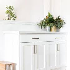 However, make sure the spacing of hardware for both wall cabinets and base cabinets should match for symmetry. White Shaker Kitchen Cabinets Brushed Brass Cabinet Pulls Design Ideas
