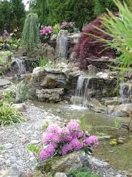 Pin By Lee Patten On Pondless Waterfalls Disappearing Waterfalls Waterfalls Backyard Outdoor Gardens Pool Landscaping