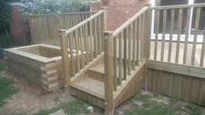Metal deck railings often blend well with masonry homes. Decking