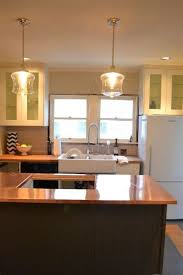 Hang a large chandelier in the center of a large kitchen or hang two of the same chandeliers over the dining table or kitchen island. Kitchen Island Lighting Ideas Kitchen Table Lighting Ideas Houzz Kitchen Lightin Kitchen Sink Lighting Kitchen Lighting Fixtures Over Kitchen Sink Lighting