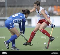 England's Sally Walton is challenged by South Korea's Jong Hee Kim (left)  during the Group A match of Rabo FIH Women's Champions Trophy at the  Wagener Stadium, Amsterdam, Netherlands Stock Photo -