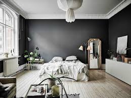 Black feature wall living room. The Time To Try Painting Black Walls At Home Is Now Tlc Interiors