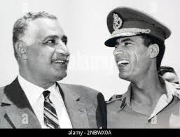 In this undated 1969 photo, Egypt's President Gamal Abdel Nasser, left, is  seen with Libyan leader, Col. Moammar Gadhafi, right, in Suez, Egypt. (AP  Photo/ Farouk Ibrahim Stock Photo