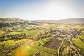 This is differentiated from an overhead shot as it is simply an angle that places the subject below the camera. Green Field Top Angle Photography Bird S Eye View Landscape Rural Area Sunglare Piqsels