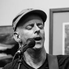 Willy Porter performing at a house concert