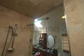 Barn door style sliding glass shower doors are made from frameless glass and operate by means of rollers that move along a metal bar near the top of the enclosure. Frameless Steam Shower Door With A Hinged Top Panel Transom Photo Gallery And Image Library Steamsaunabath