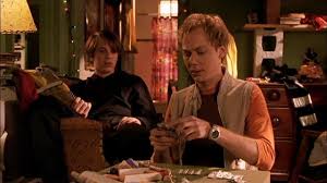 He befriends a virtually homeless college student whom he falls for, but she's dating a nasty professor. Loser 2000