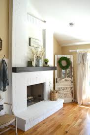 The finished fireplace, all painted and accessorized! How To Paint A Brick Fireplace Sarah Joy