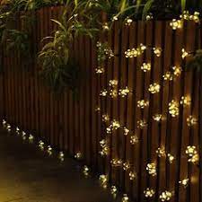 If you're looking to hang outdoor lights but you don't have any trees, fences, or structures to hang. 9 Fairy Lights On Fencing Ideas Fairy Lights Lights Christmas Lights