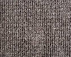 Natural fibers are woven to create a chunky honeycomb appearance, which is at home in any room in your house, given the neutral colors. Natural Grey Hand Knitted Carpet Pure Wool