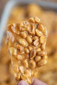 Peanut Brittle Is The Perfect Party Dessert Made With Butter Peanuts And Corn Syrup It S Sweet Crunch Peanut Brittle Brittle Recipes Peanut Brittle Recipe