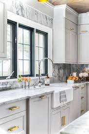 Using modern kitchen cabinet pulls on the base cabinet hardware can be used to mimic the lines of the shelves, like the stainless steel liberty cabinet bar pull or the linear. Antique Brass Pulls On Light Gray Shaker Kitchen Drawers Transitional Kitchen