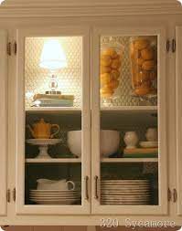 Oak kitchen cabinets with glass doors. These Used To Be Plain Old Oak Cabinets And She Did All Of This For Under 10 Bucks For Glass Kitchen Cabinet Doors Glass Cabinet Doors Diy Glass Cabinet Doors
