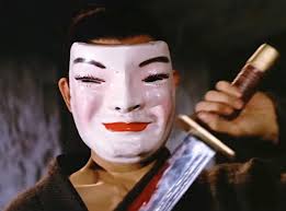 Who is the man wearing the mask?