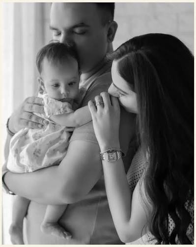 Black & White Family Embrace with Kissed Infant Portrait