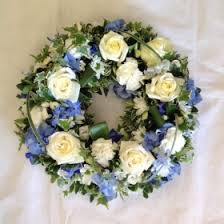 Purple iris and blue iris are often used as funeral flowers for soldiers as they convey respect, hope and faith. Blue Hydrangea Wreath Buy Online Or Call 01353 721336
