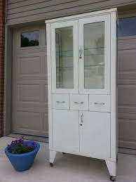 Hangzhou dingli industry and trade company specializes in the production of metal. Item Is Reserved 1950s Shampaine Co Medical Hospital Style Metal Cabinet With Glass Doors Medical Furniture Glass Cabinet Doors Cabinet Style