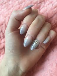 These acrylic nail designs are glamorous and unique, giving you the inspiration you'll need to create 9. New Set Of Pink And Grey Lilac Ombre Acrylics With A Glitter Accent Nail The Princess Wardrobe