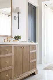 White Oak Bathroom Vanity With Brass Hardware Love The Mix Of Metals Withe The Black Wall Sconce Desi Oak Bathroom Vanity Classic Bathroom Bathroom Interior