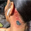 A chinese character for love, behind the ear tattoo. 3